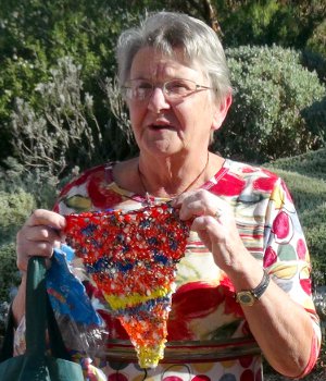 Margaret Doecke shows off Bright Plastic Pennant Flag made from Bread Bags