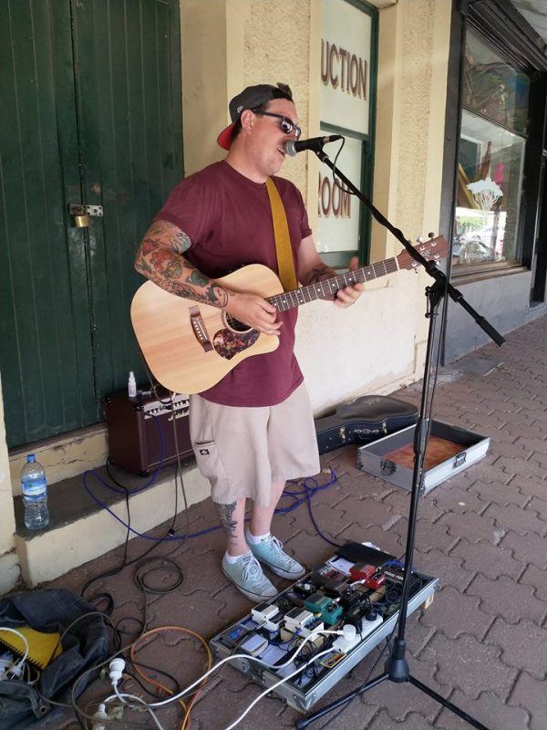 Peter Noble Student Minister busking in Eudunda 300119